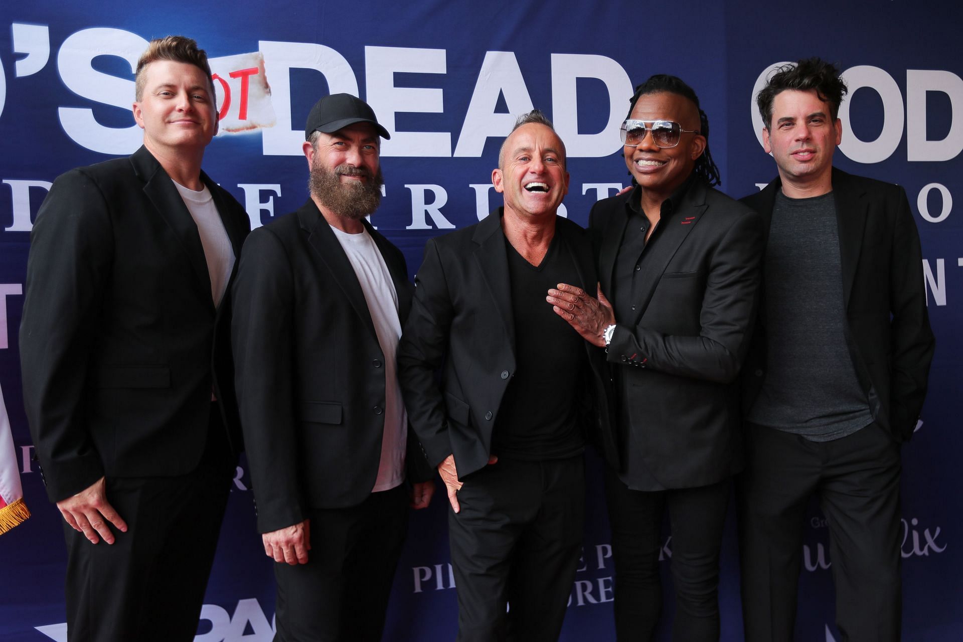 Michael Tait with Newsboys bandmates at the "God's Not Dead: In God We Trust" Premiere. (Image via Getty/ Omar Vega)